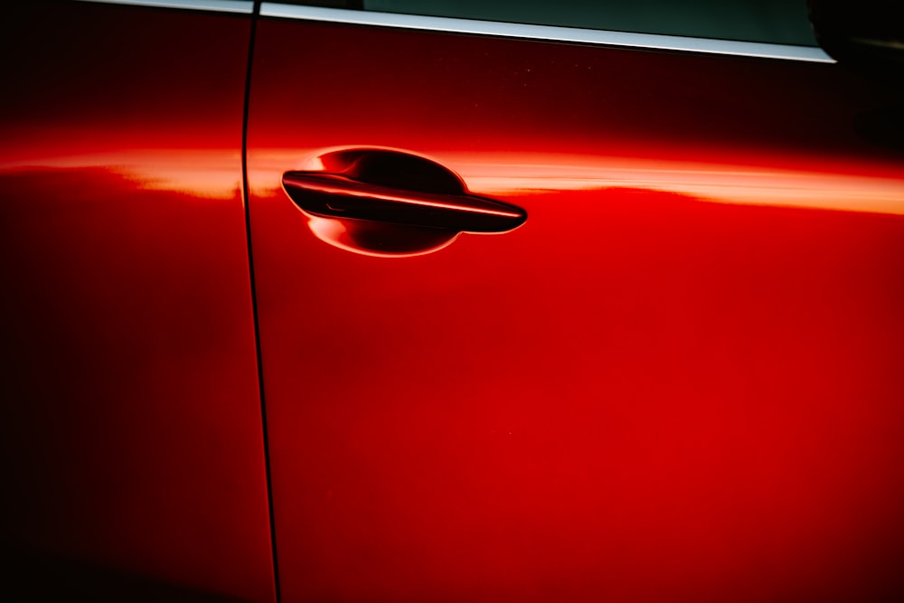 a red car with a black handle