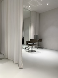A modern round mirror paired with minimalist decor in a bright space.
