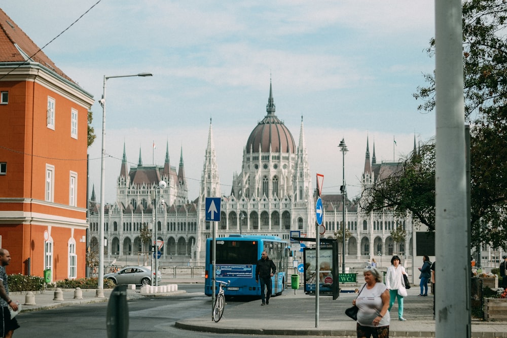 a street with a large building in the background