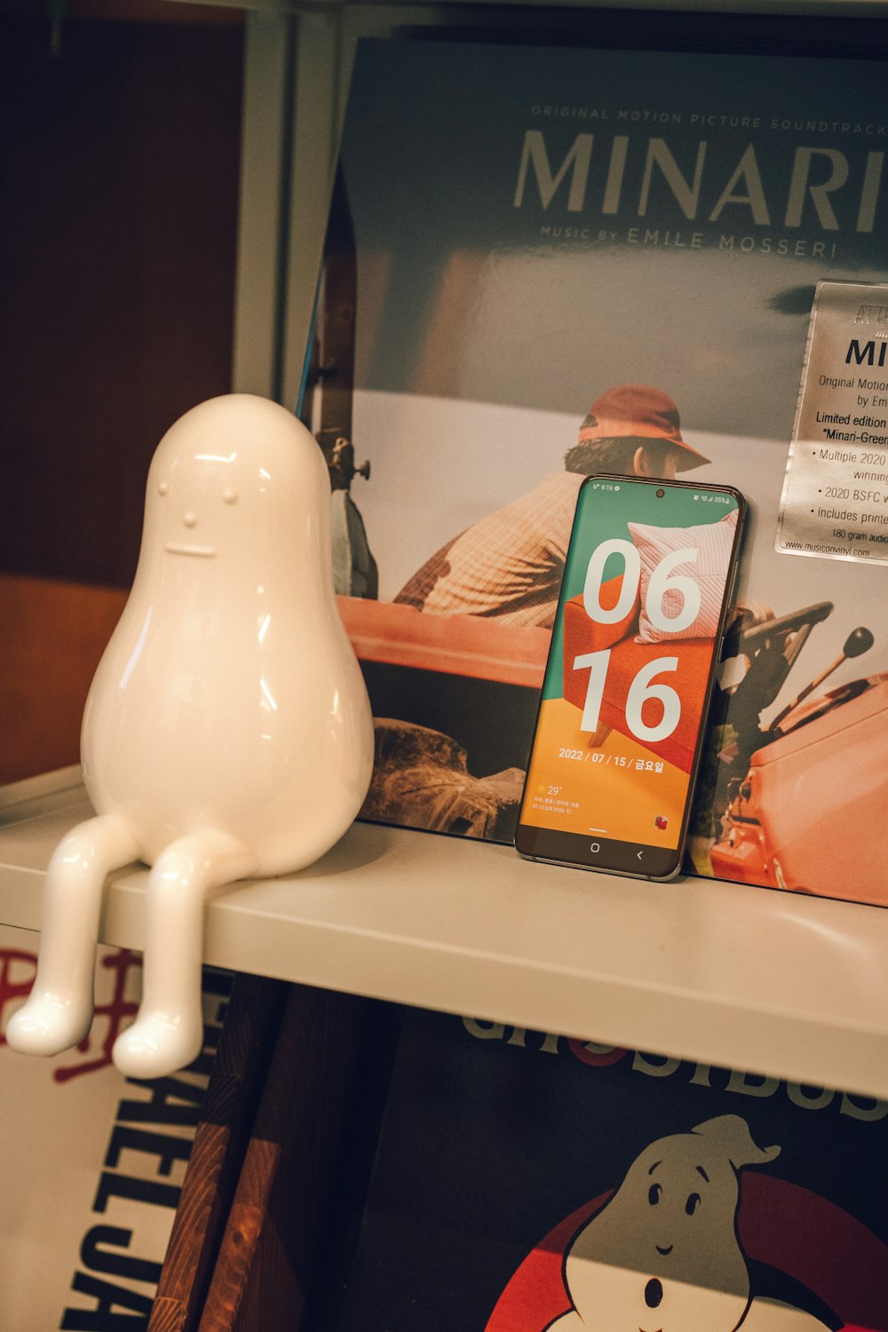 a white cat figurine on a shelf