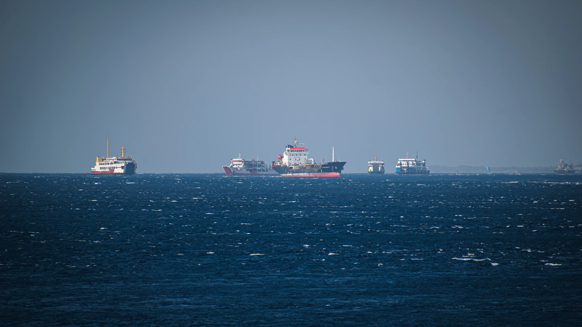 Ships at anchor offshore