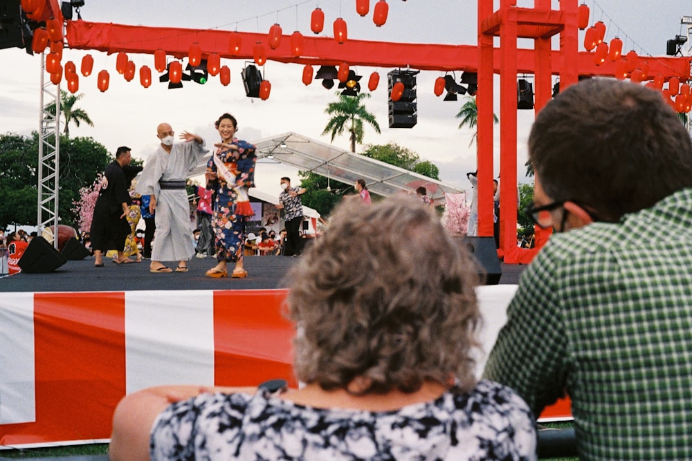 a group of people performing on stage