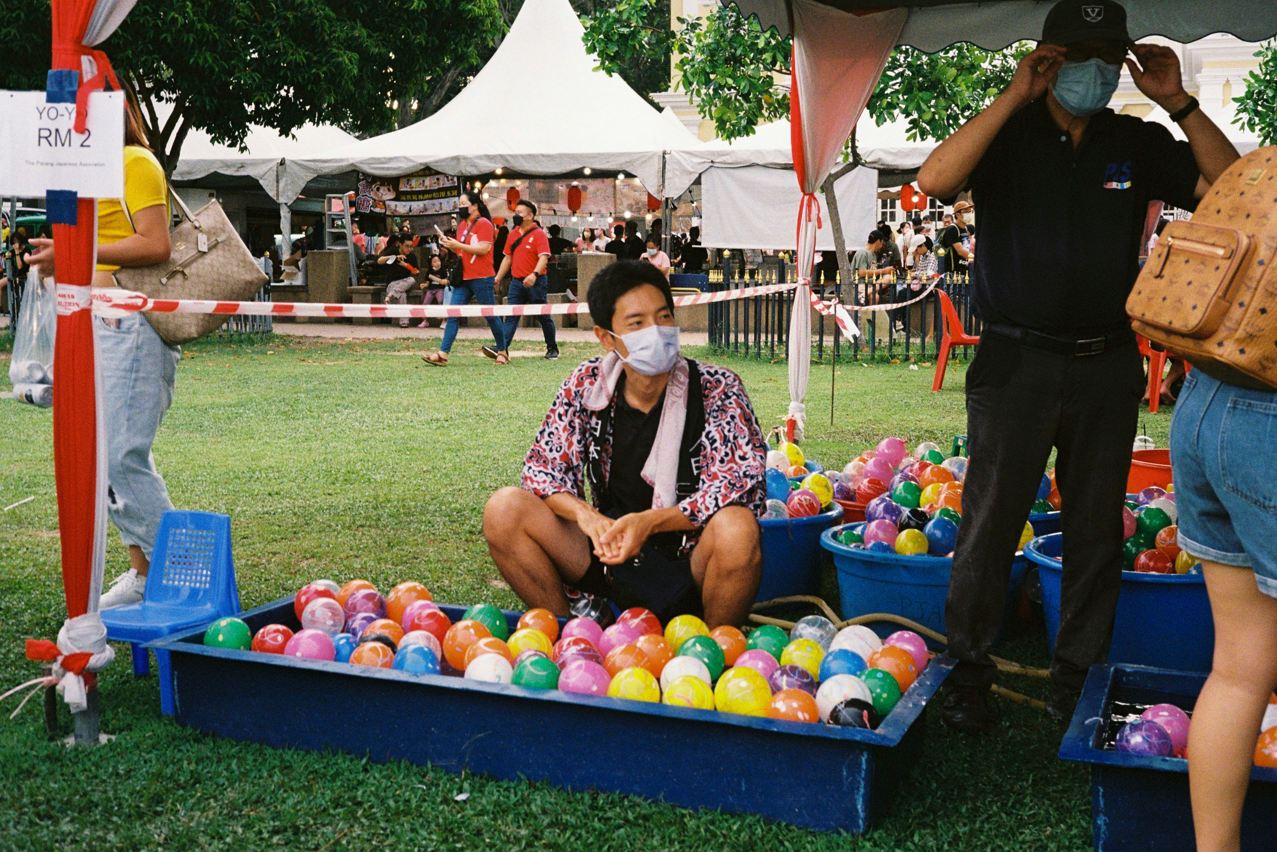 a woman sitting in a ball pit