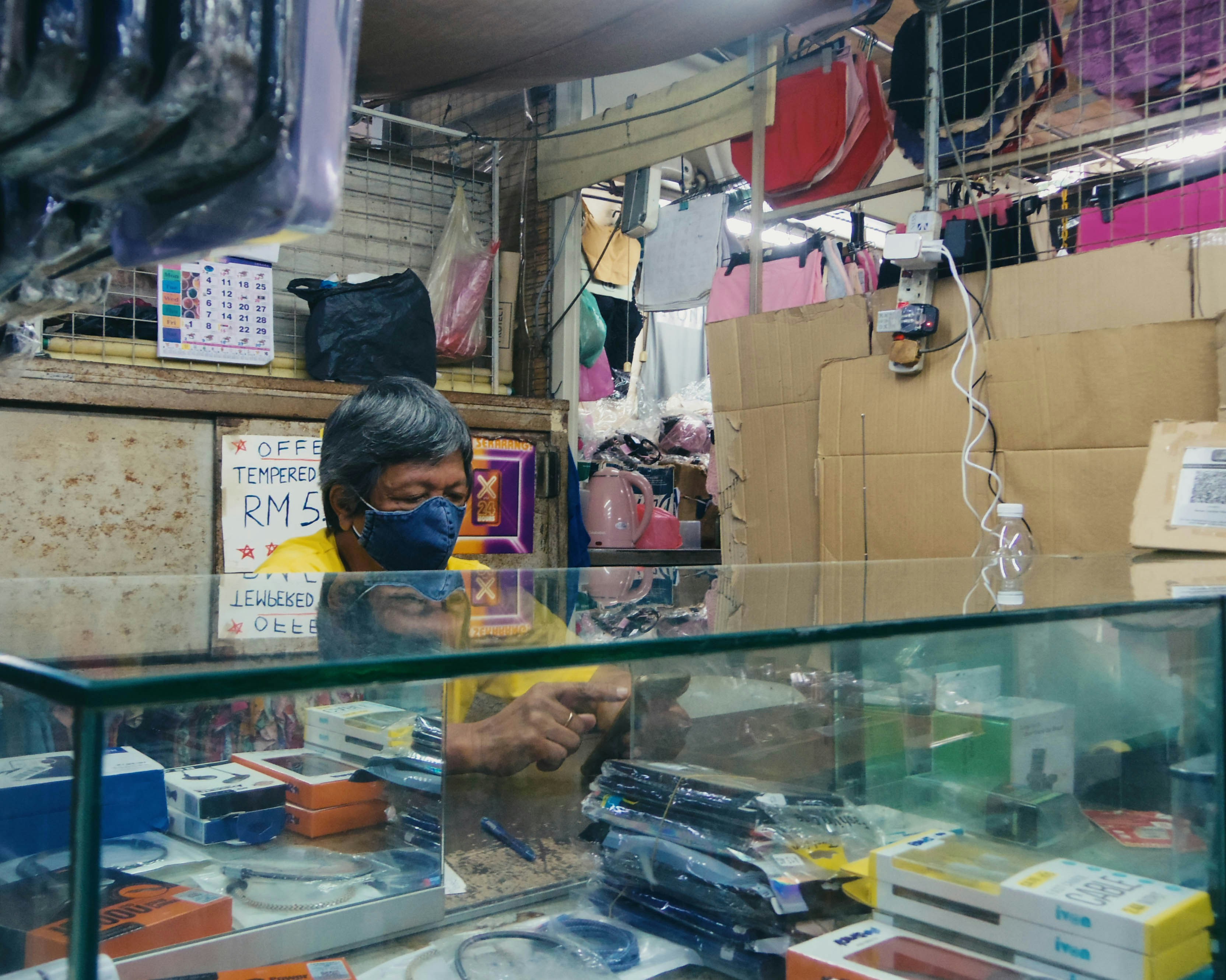 Shopkeeper wearing mask