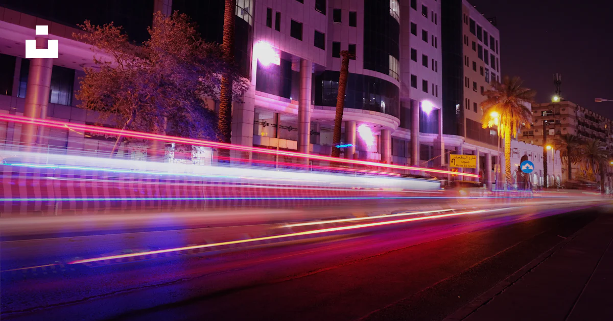 Led Tree Street A street with buildings and trees photo – Free Neon street lights Image ...