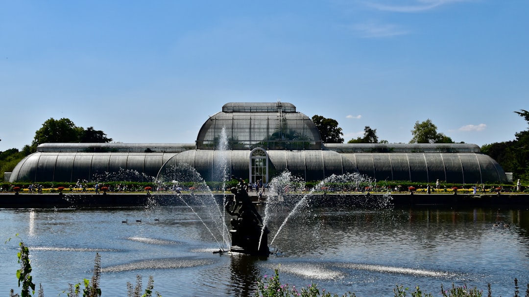 a large building with a fountain in front of it