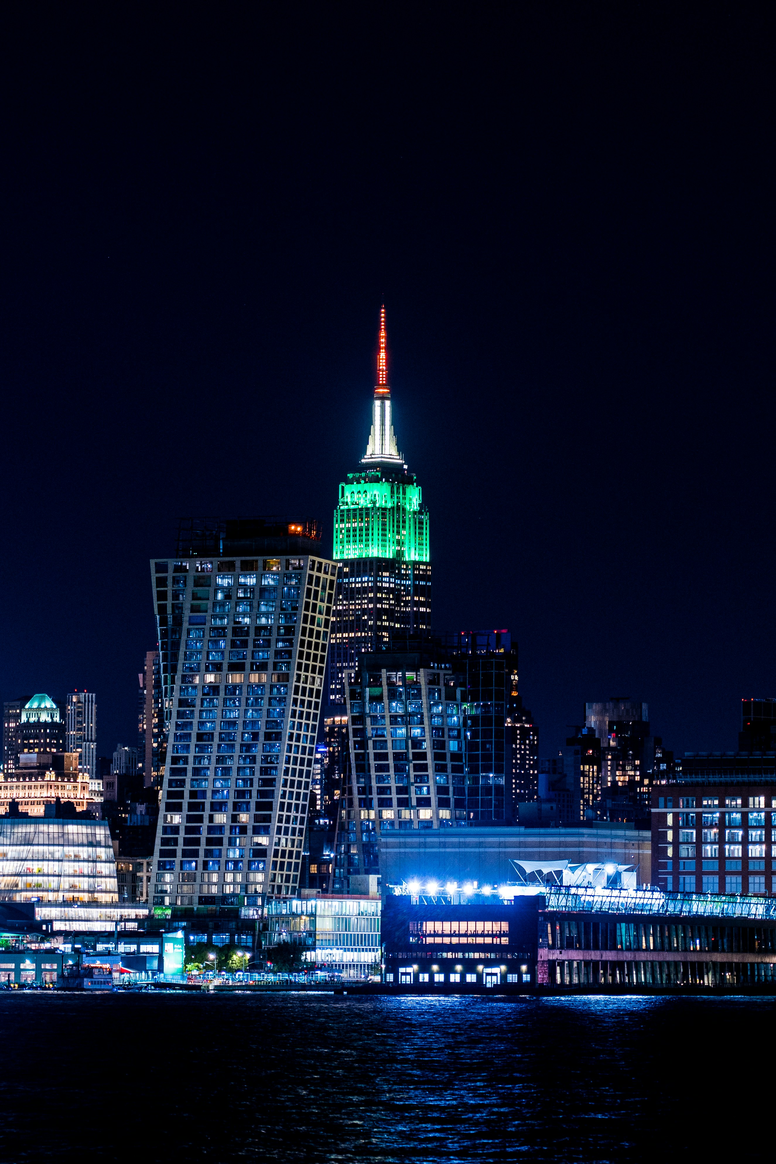 A city skyline at night photo – Free Building Image on Unsplash