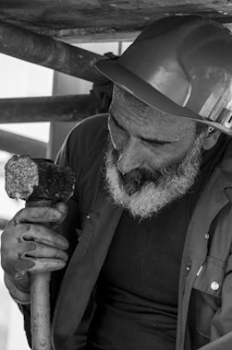 a man holding a rock