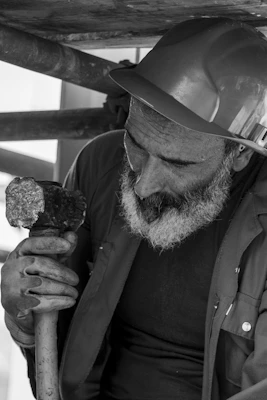 a man holding a rock