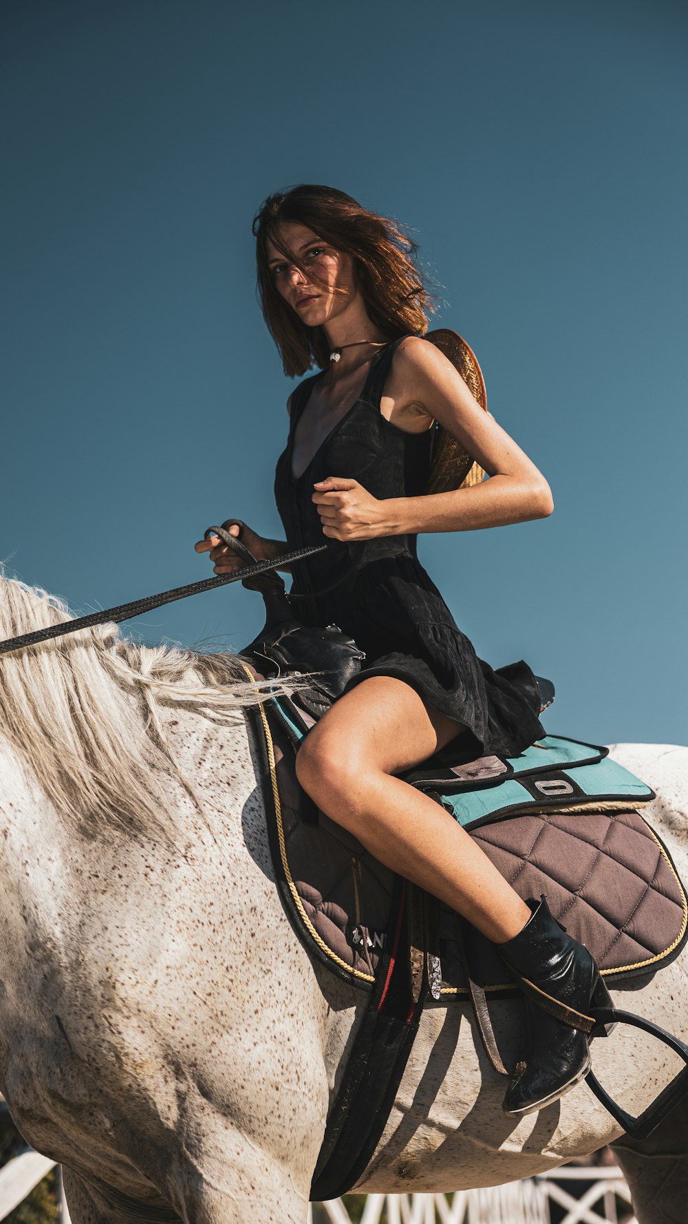 a woman sitting on a camel