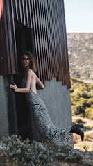 a person posing next to a zebra