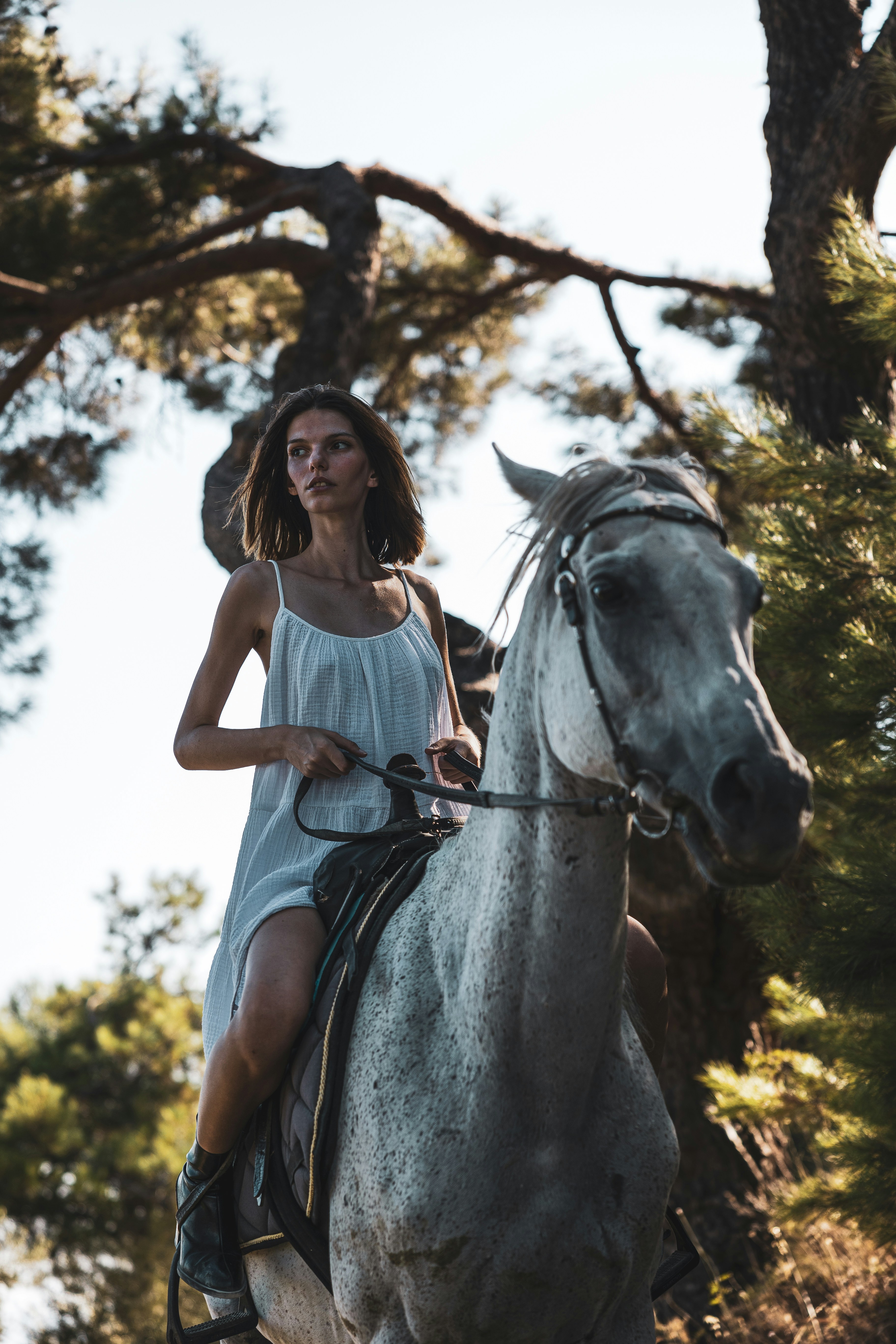 a woman riding a horse