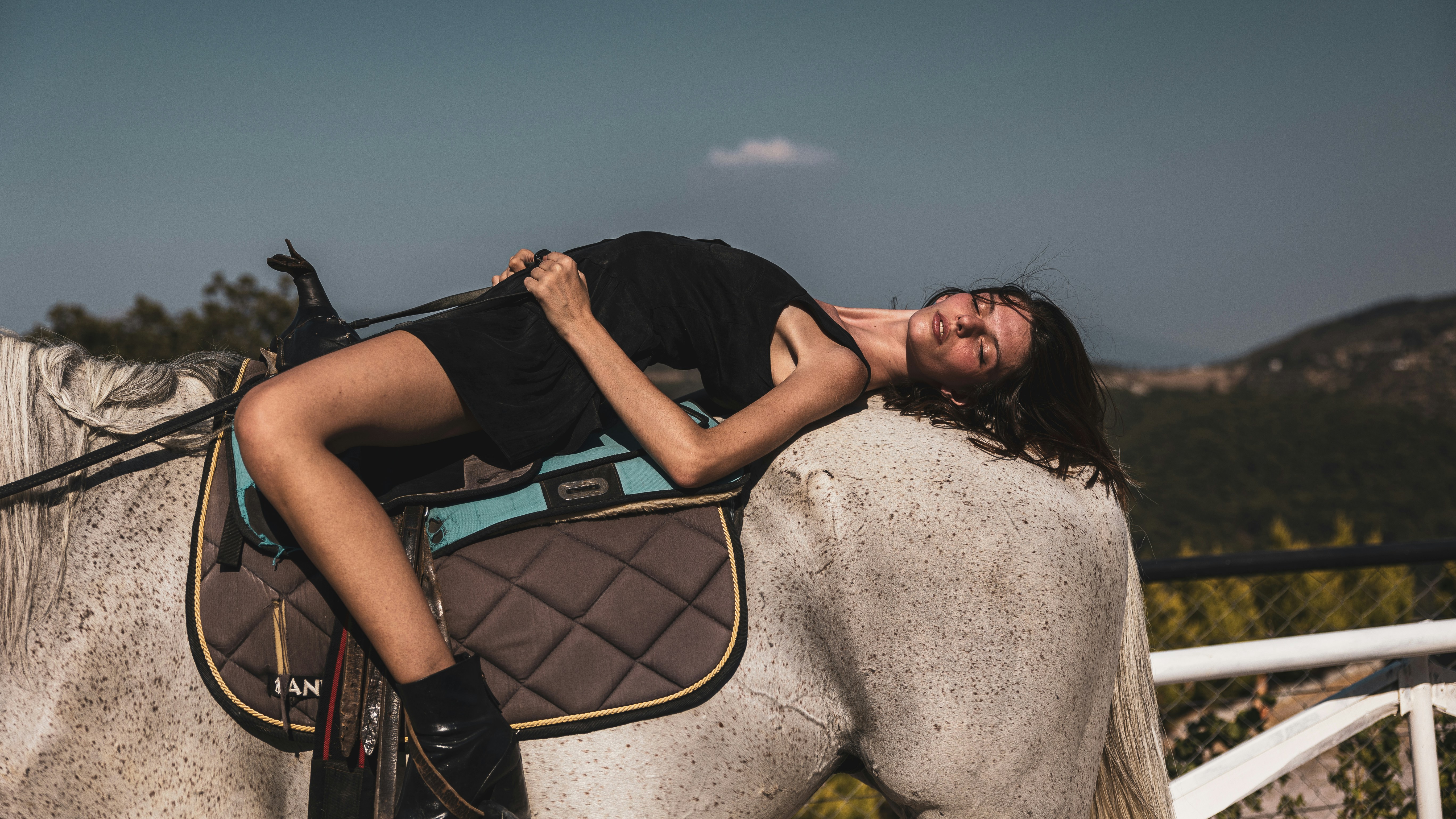 a woman riding a horse