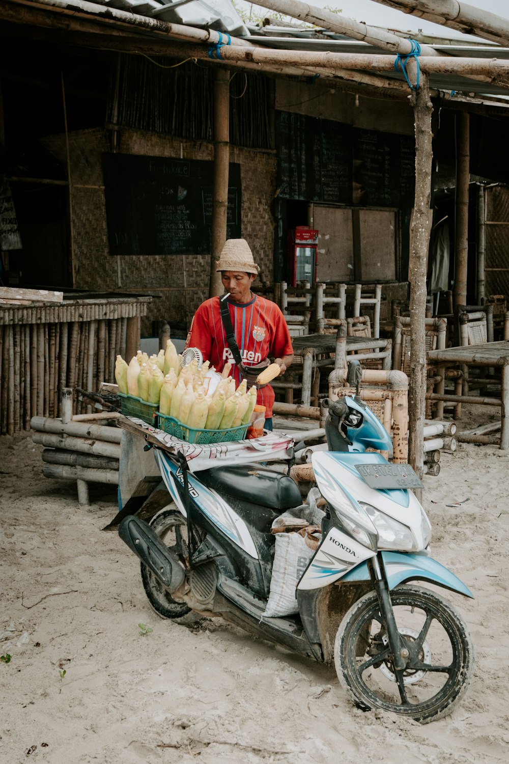 a person selling vegetables on a motorcycle