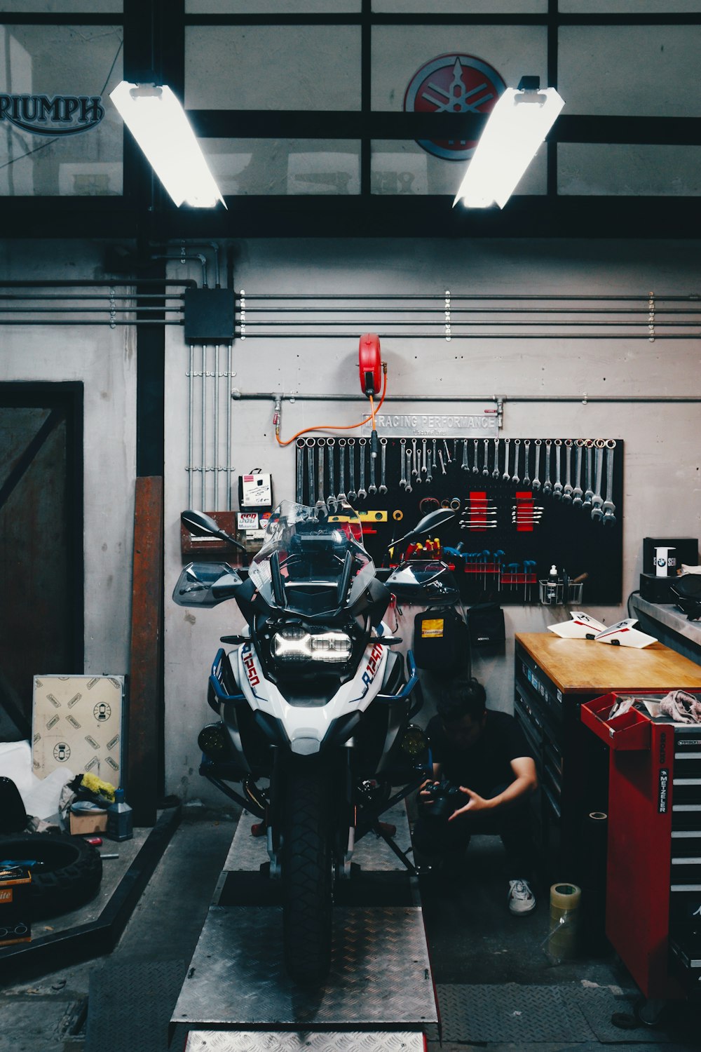 a person working on a motorcycle
