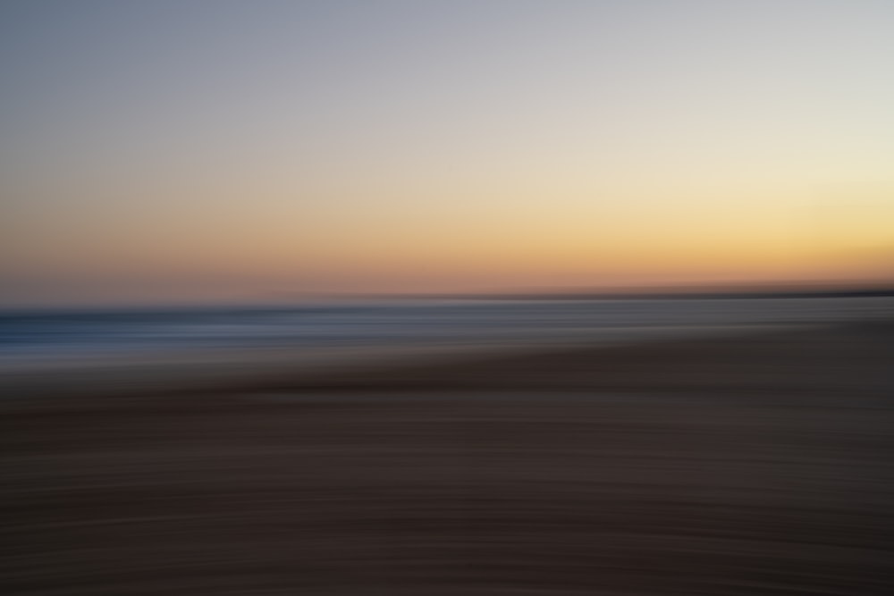 a beach with a sunset