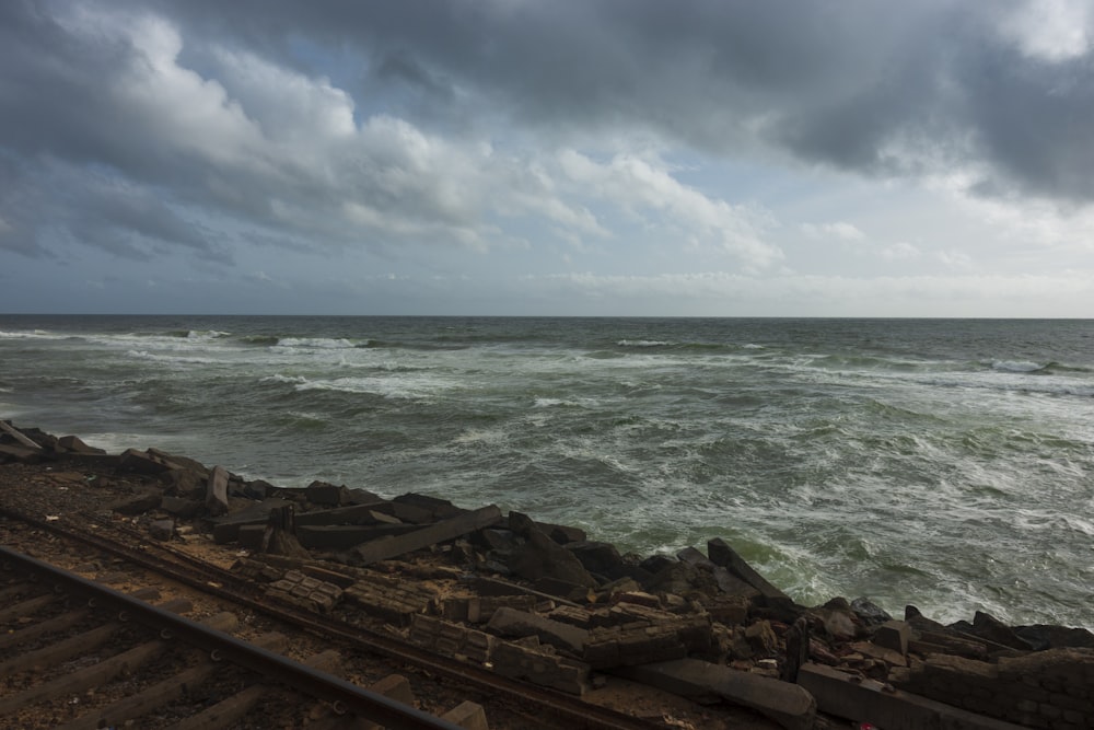 a rocky beach with waves crashing