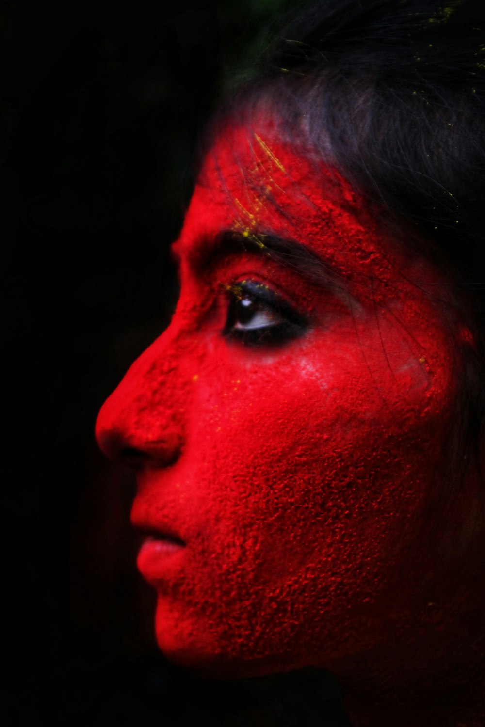 a person with red paint on their face