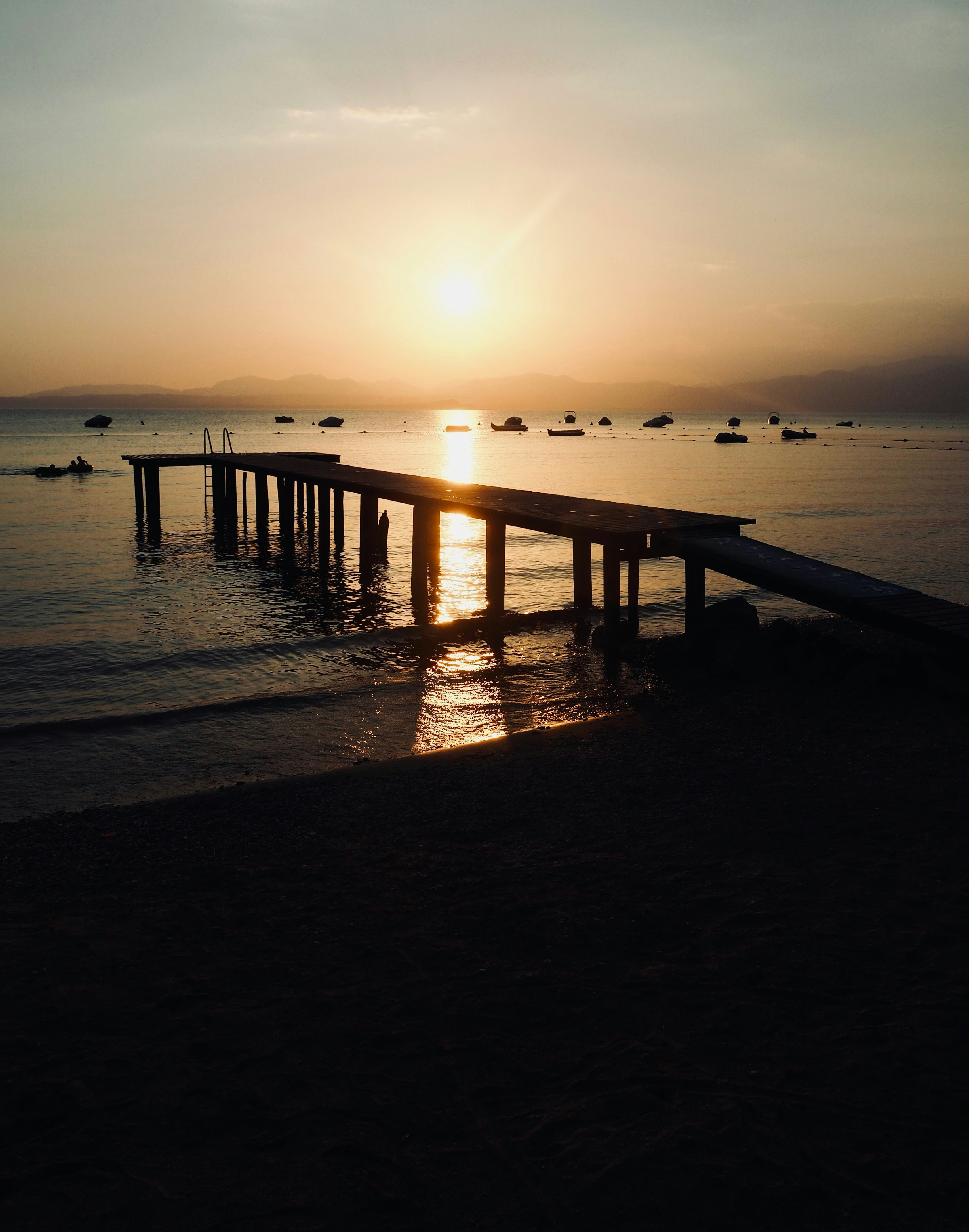 a dock with boats in the water