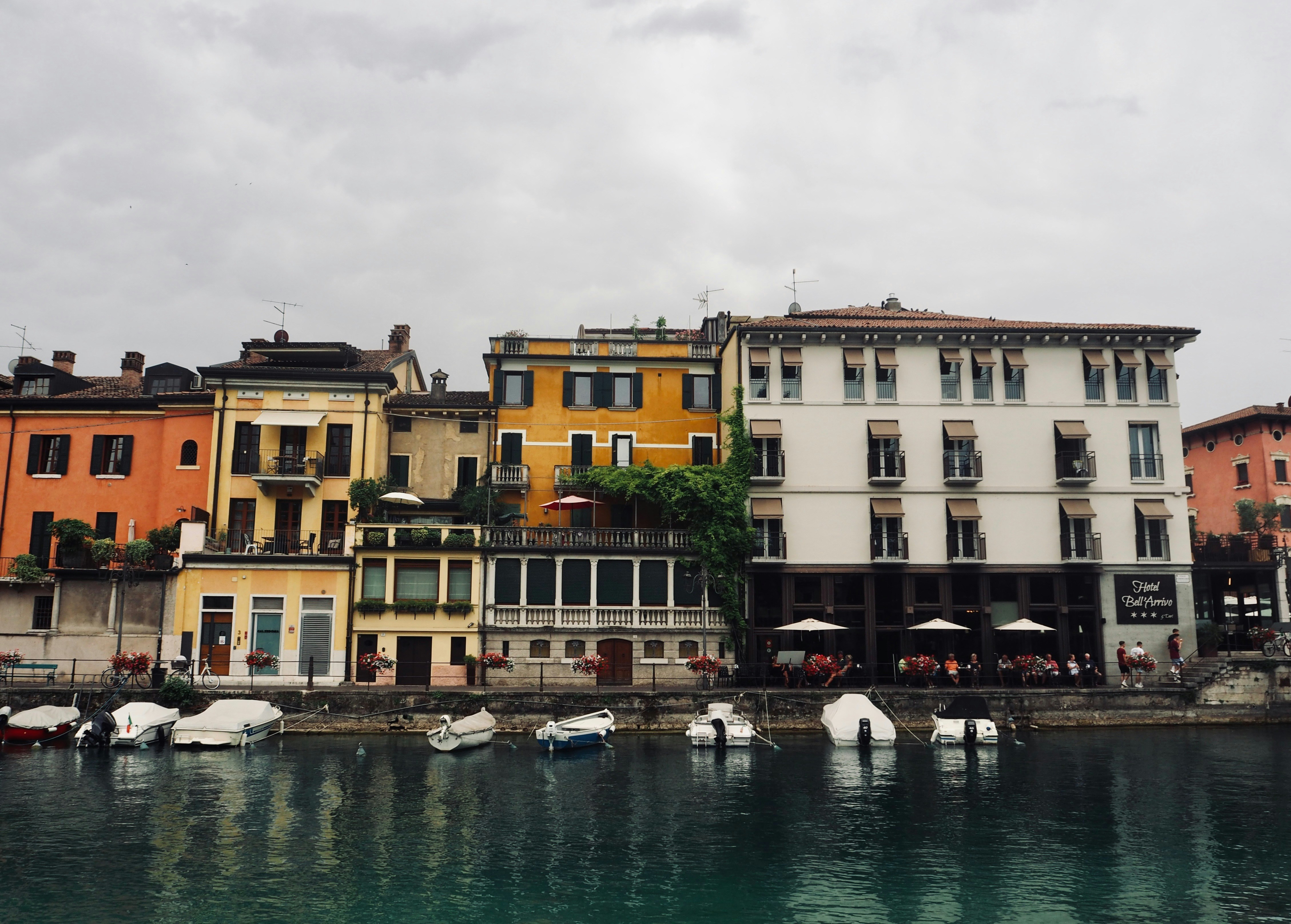 a body of water with boats in it and buildings around it