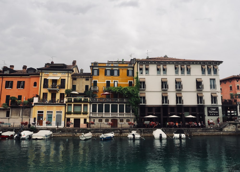 a body of water with boats in it and buildings around it