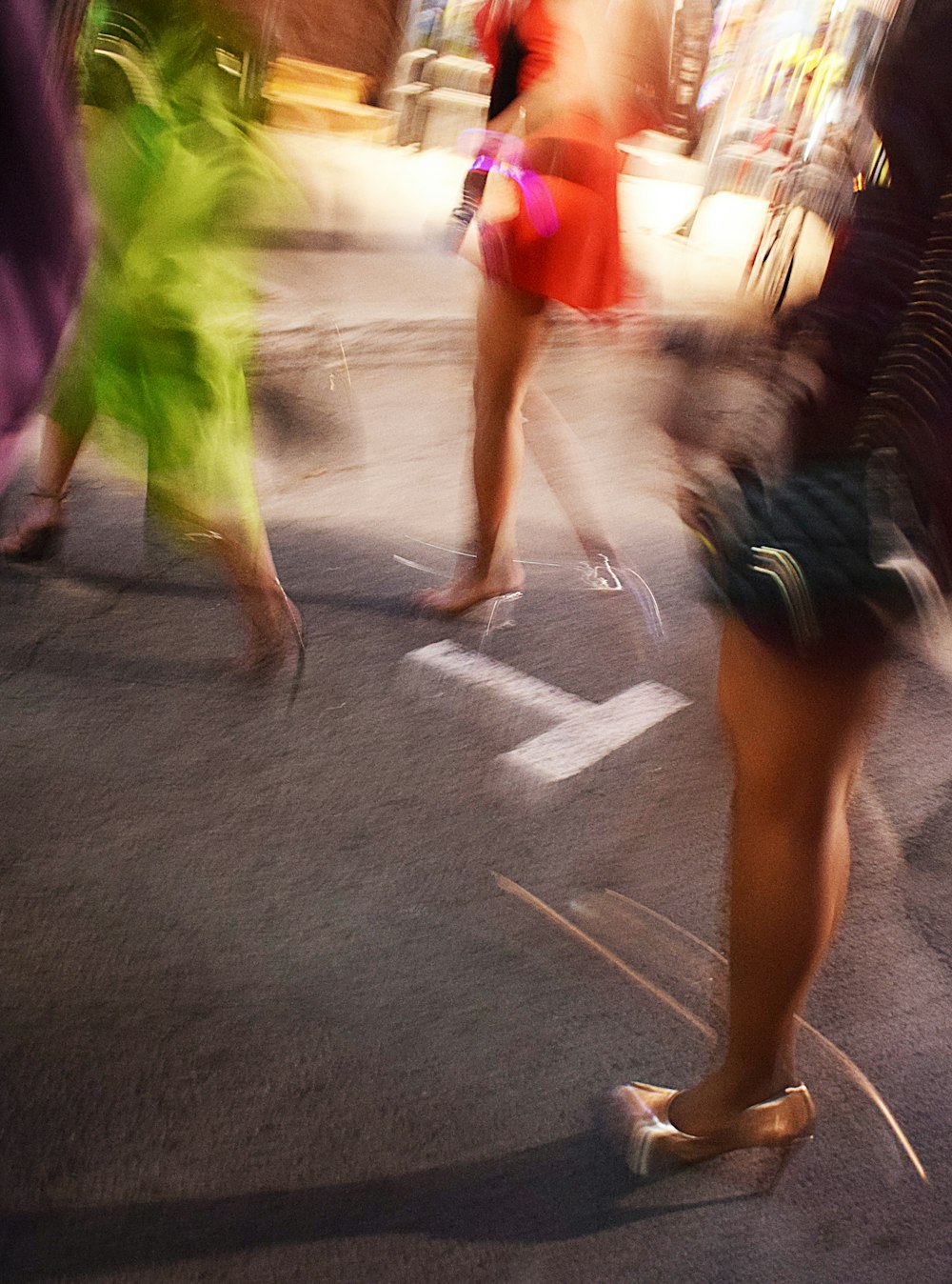 a group of people walking on a street