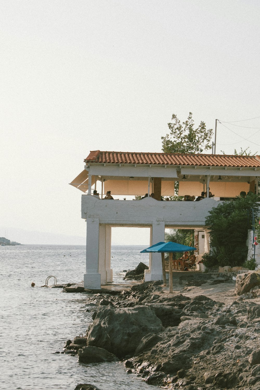 a building on a rocky shore