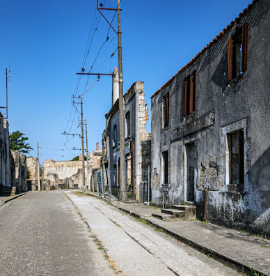 A desolate street scene with crumbling buildings and scattered debris.