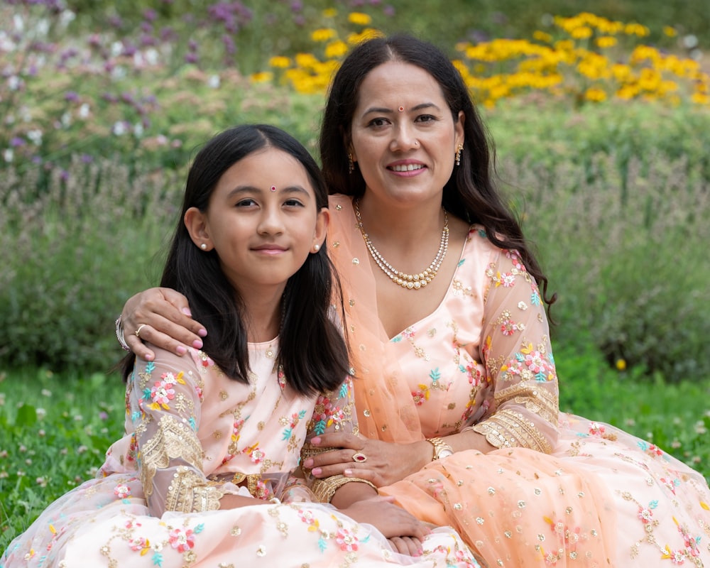 a couple of women posing for the camera