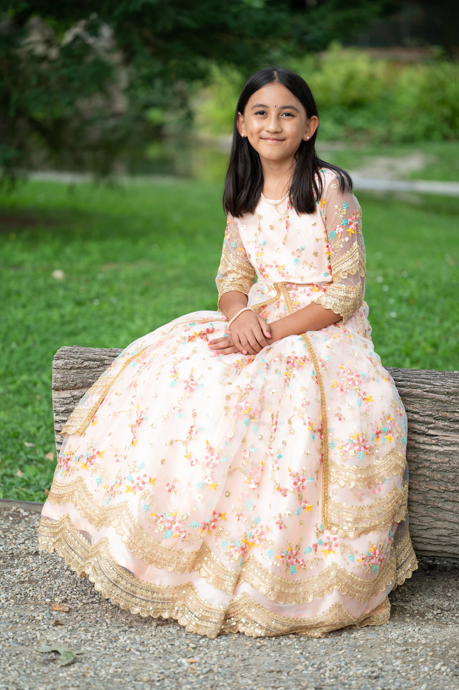 Girl in a pastel embroidered lehenga gown