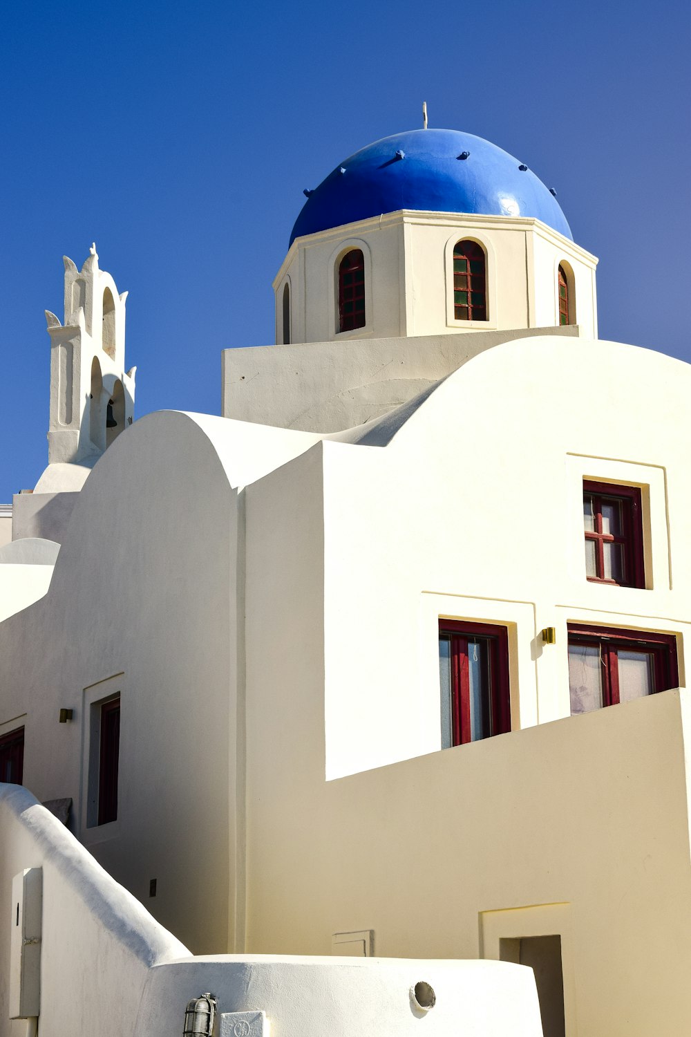 a white building with a blue dome