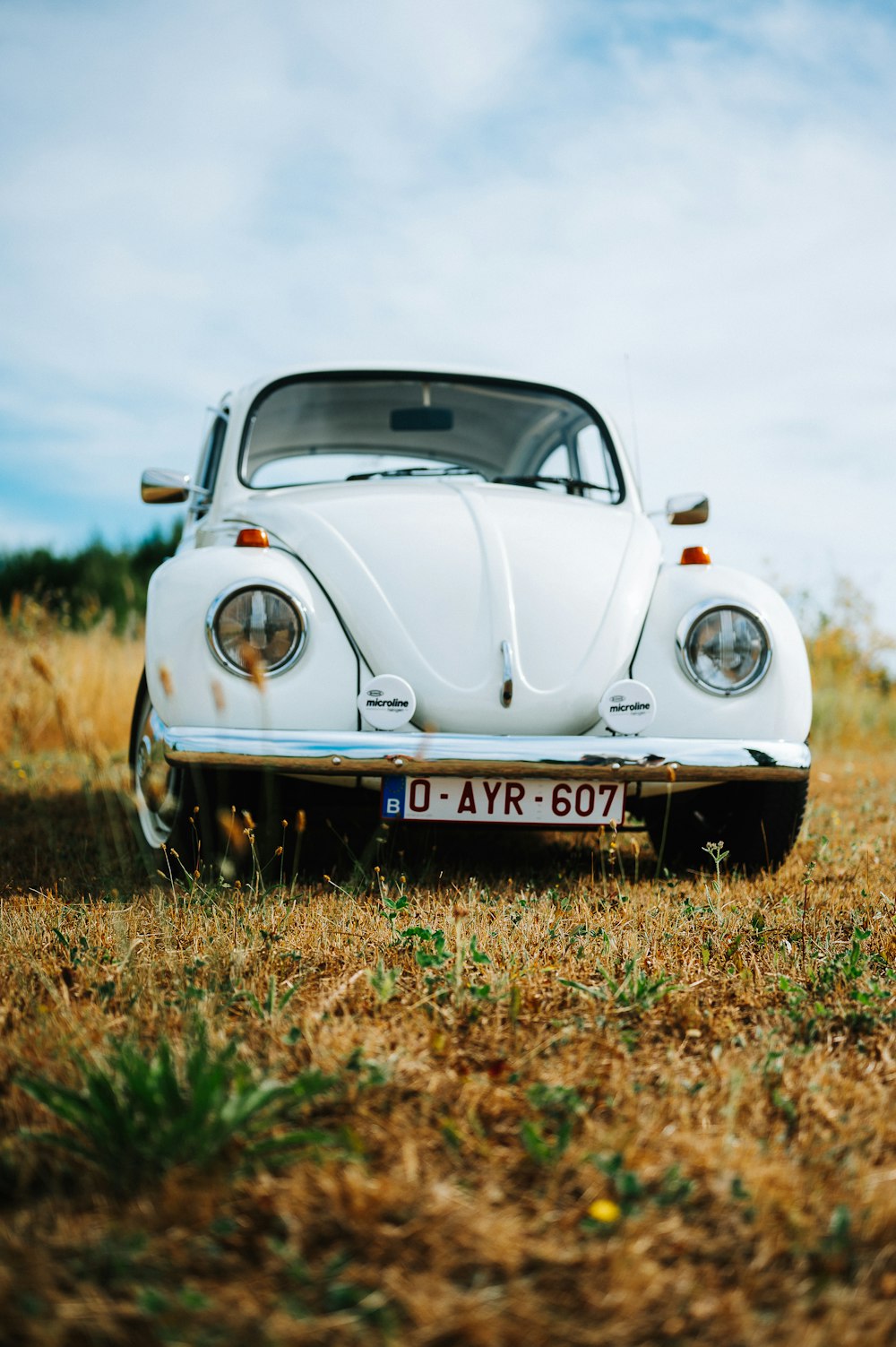 a white car parked in a field