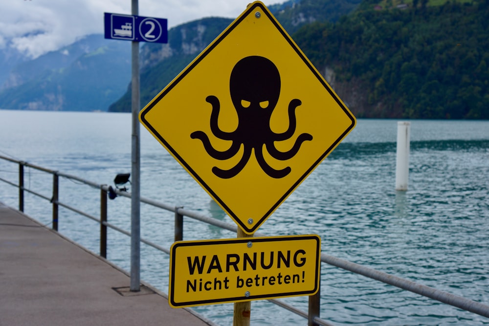 a yellow sign on a dock