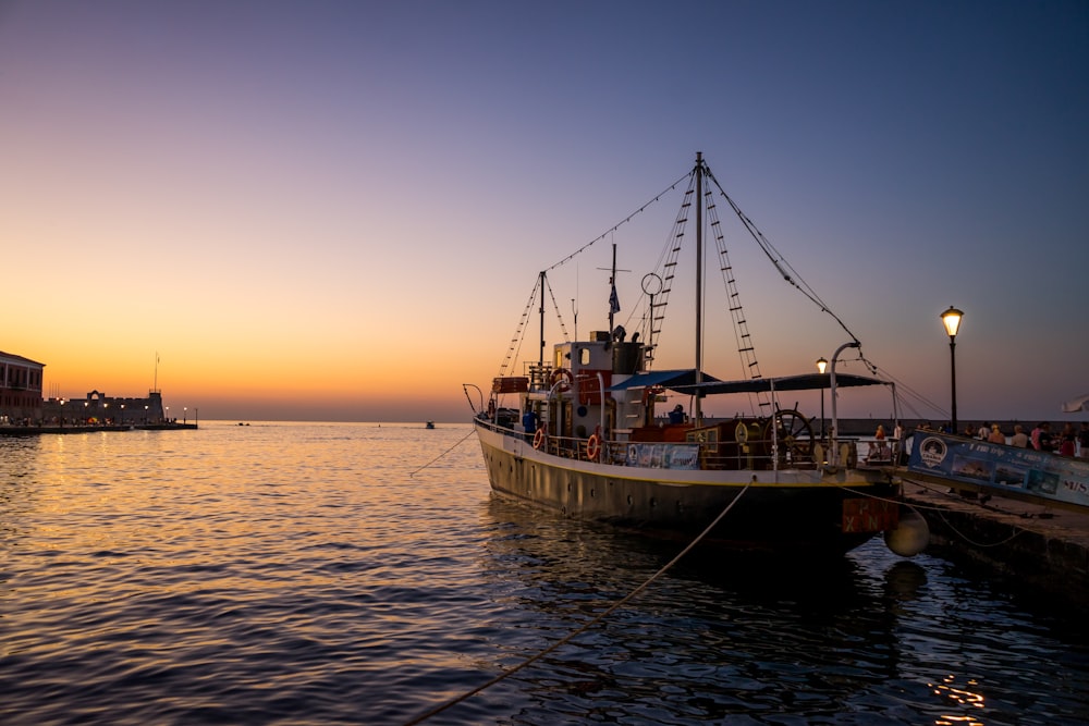 a boat docked at a pier