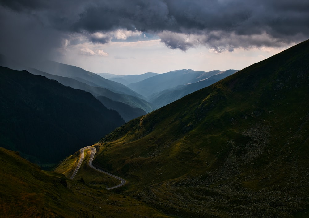 a winding road through a valley