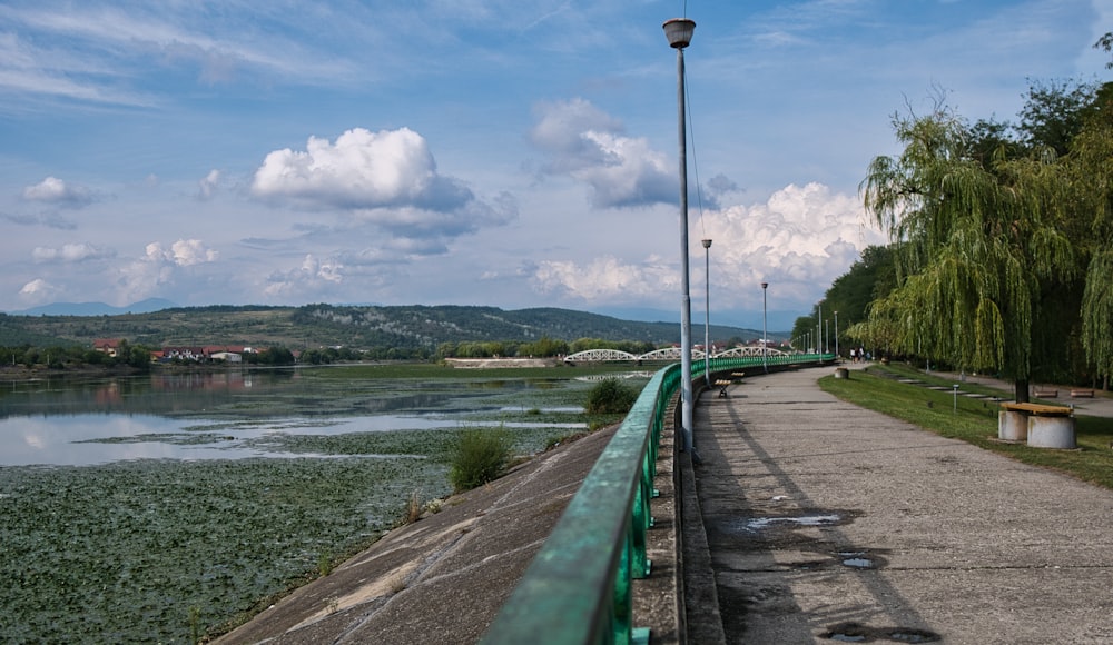 a walkway next to a body of water