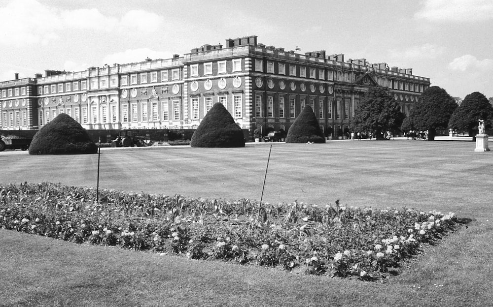 a large building with a large lawn in front of it