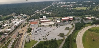 Suburban strip mall with several storefronts and ample parking.