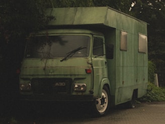 A large green van perfect for moving goods or group travel.