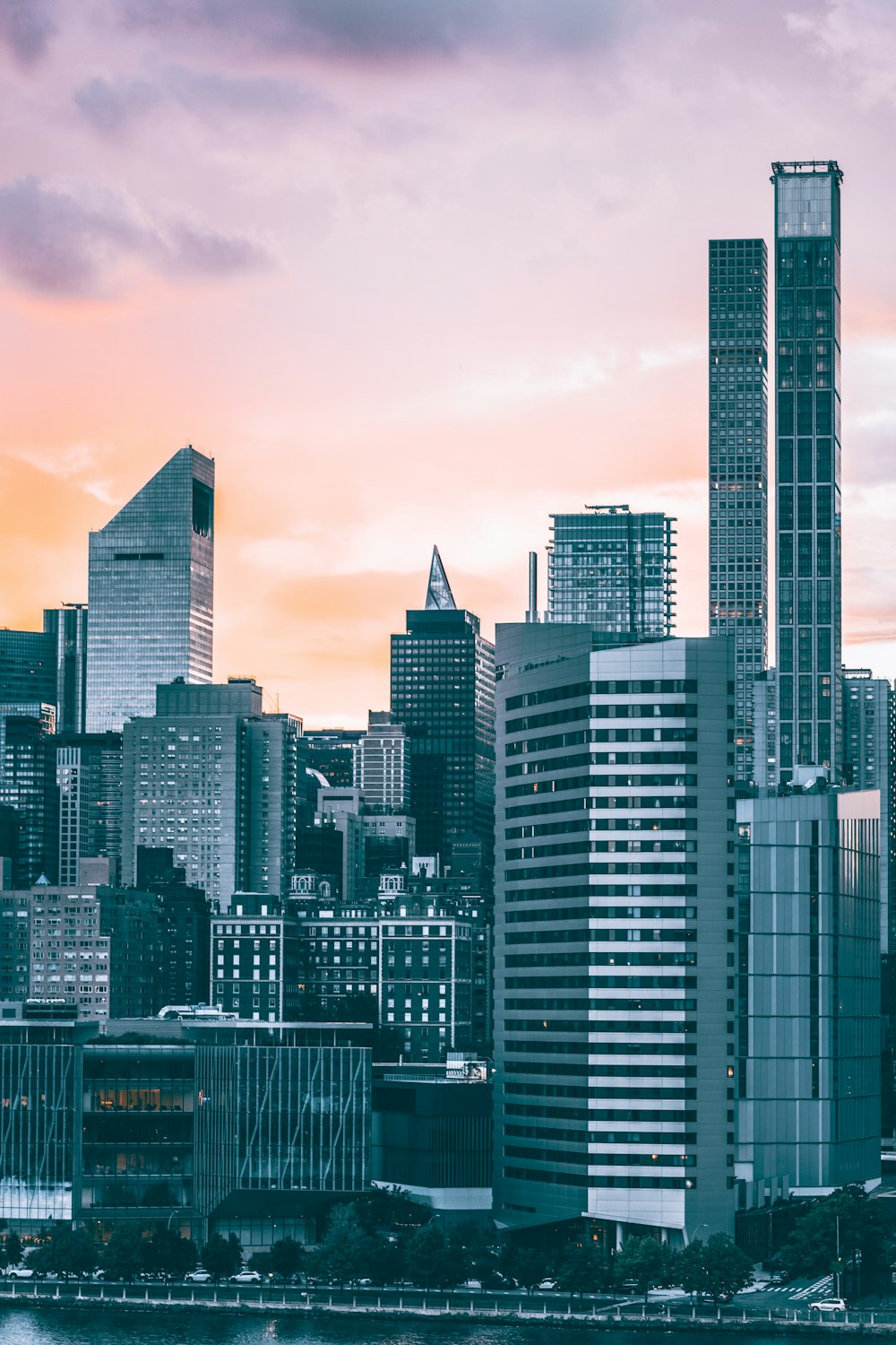 a city skyline with tall buildings