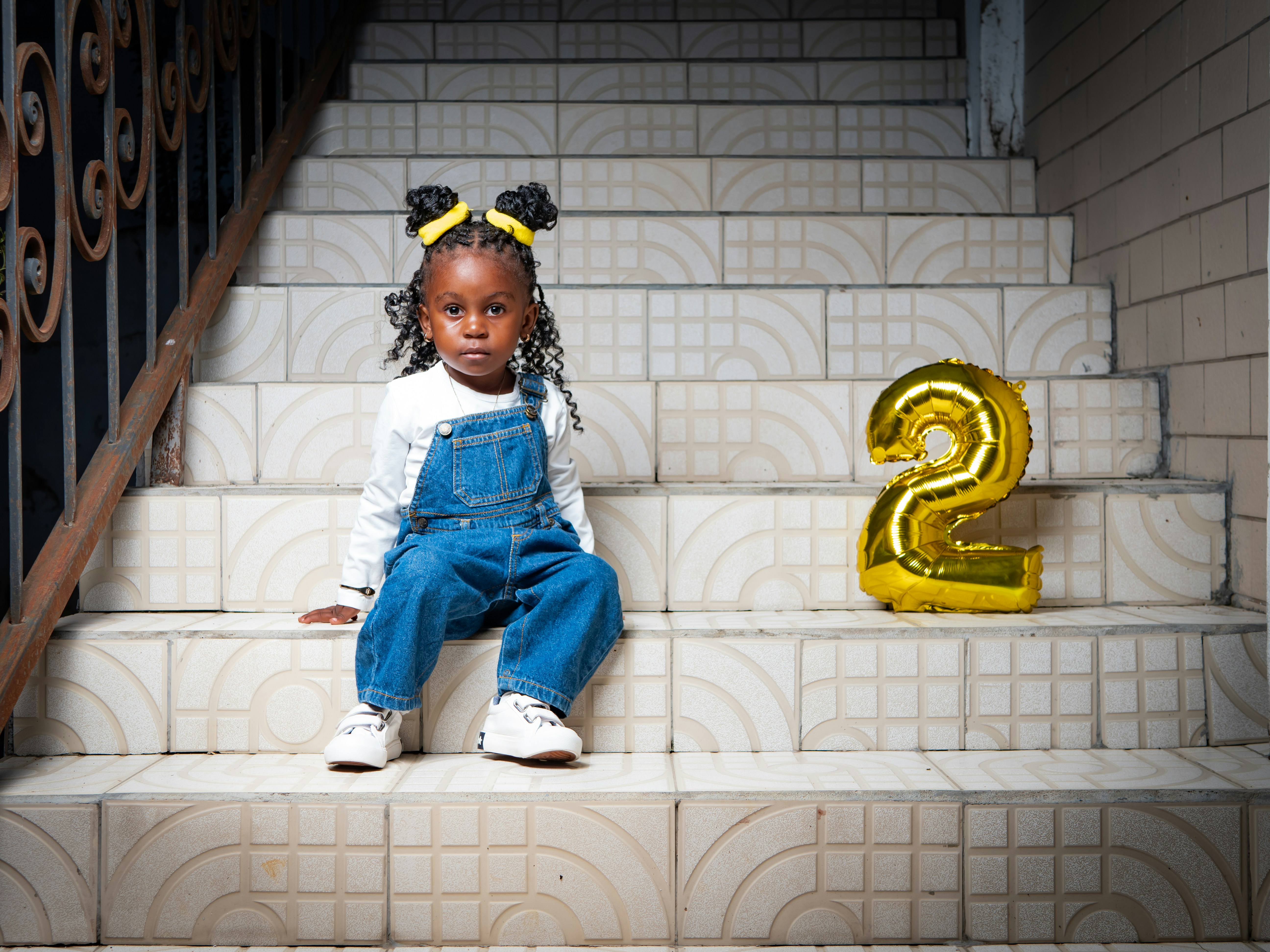 a girl sitting on a staircase