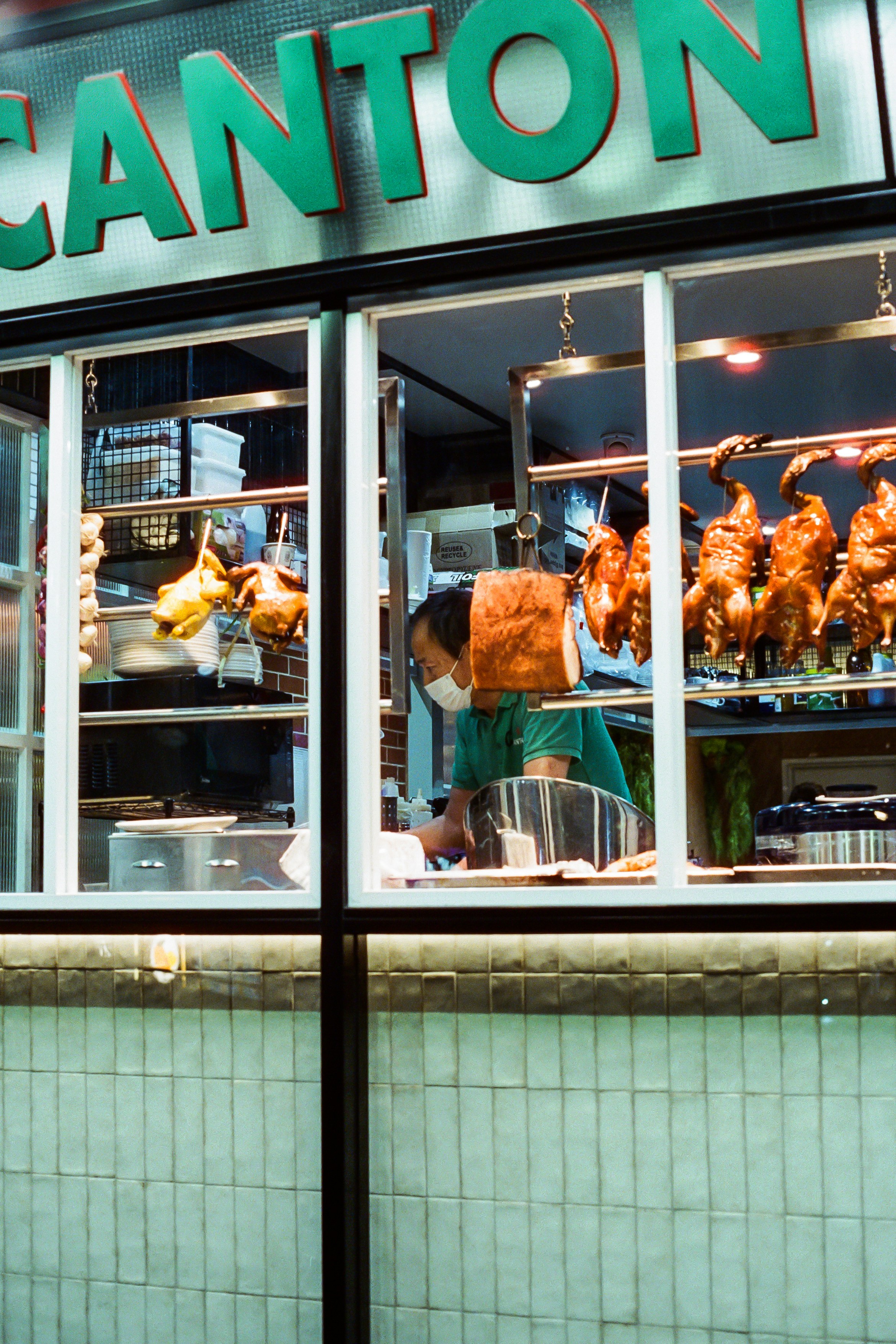 a person sitting at a table in a restaurant