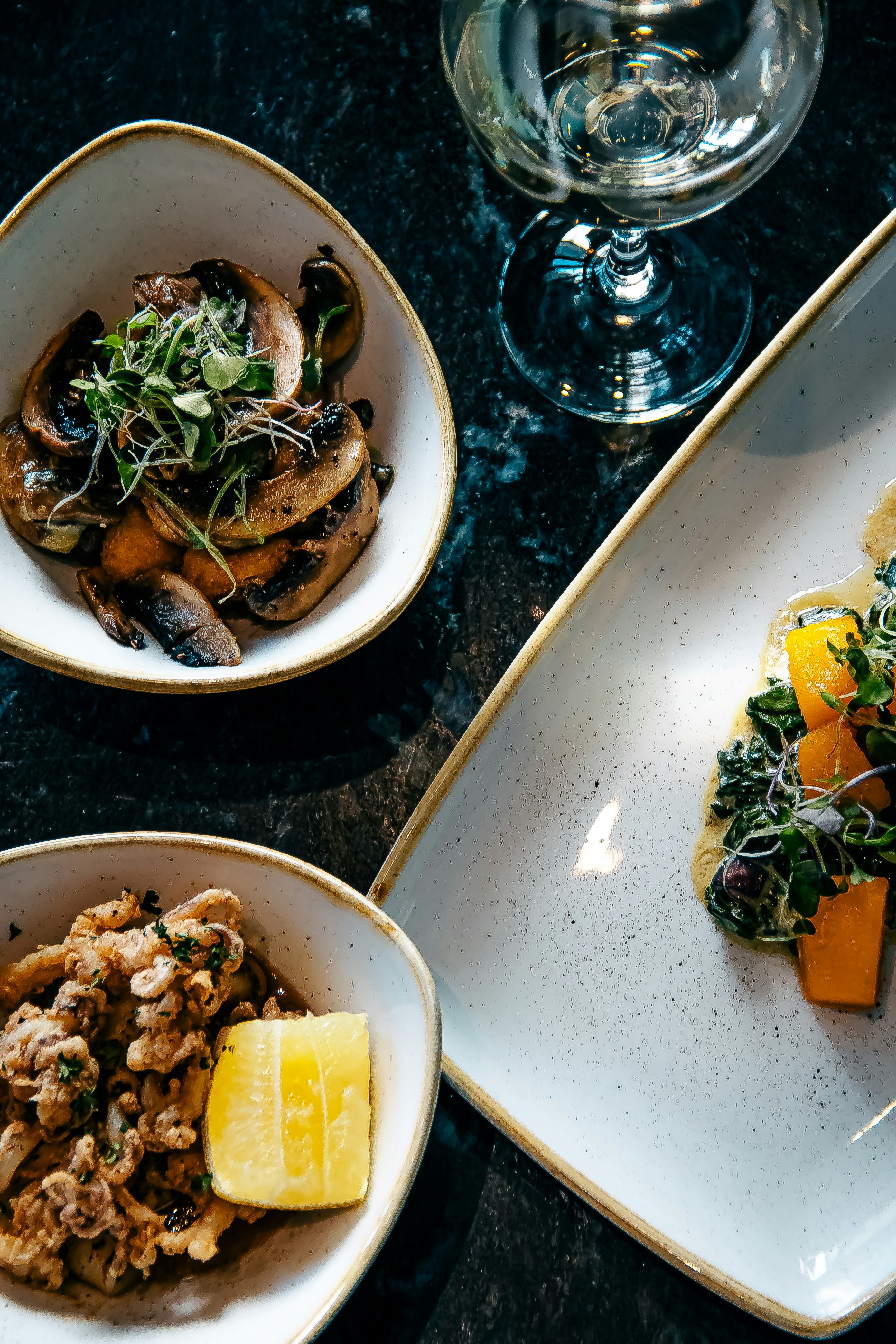 a plate of food and a glass of water