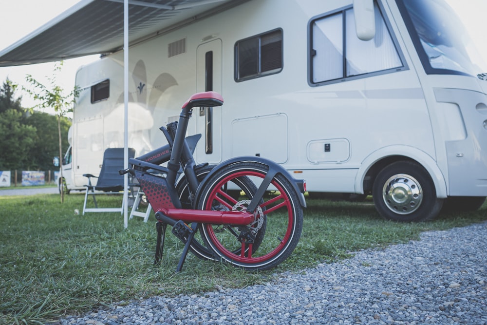 a bicycle parked in front of a white van