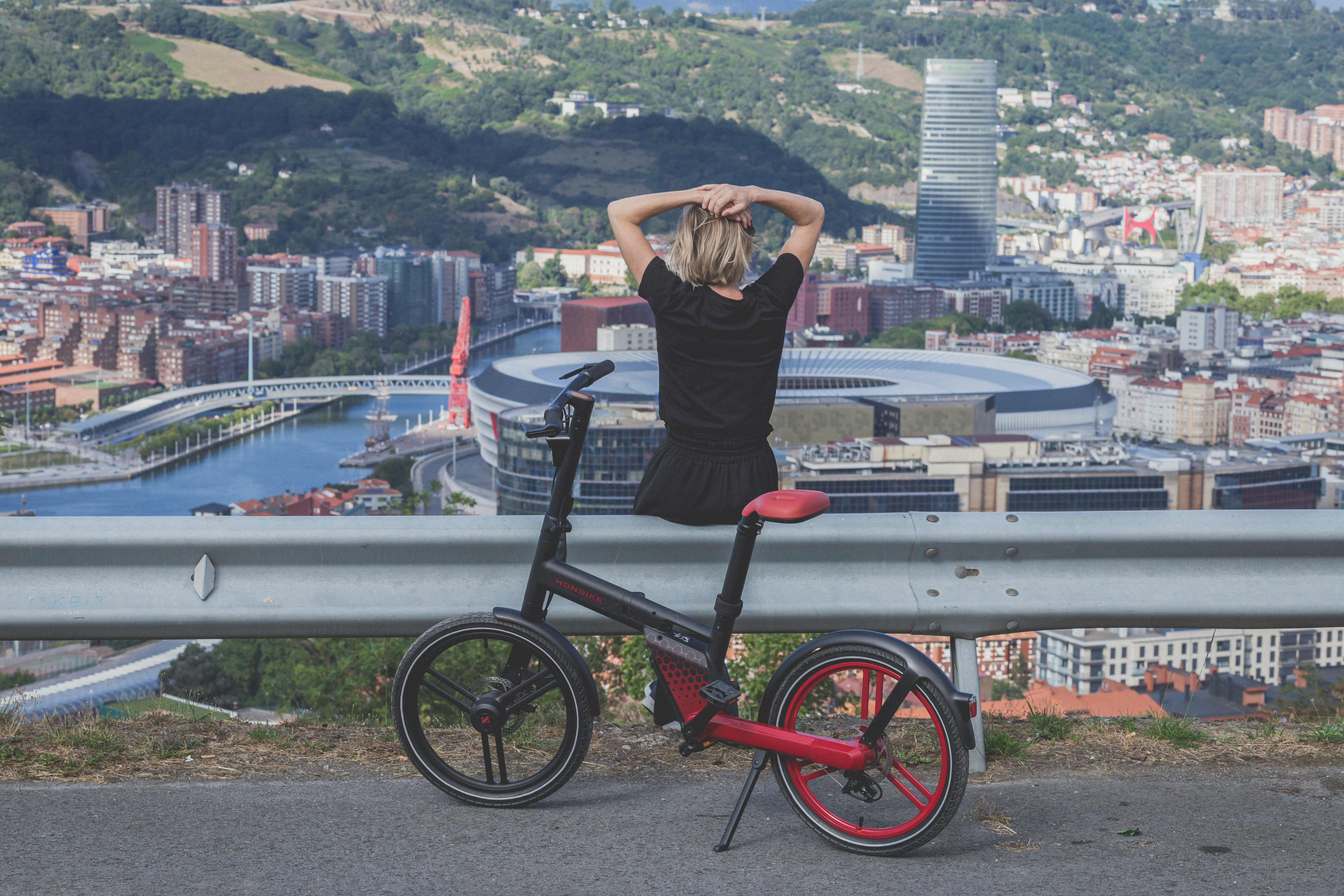 a person standing on a bicycle