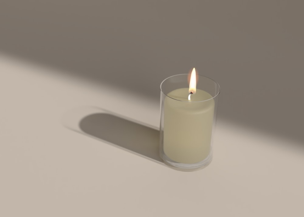 a candle in a glass holder