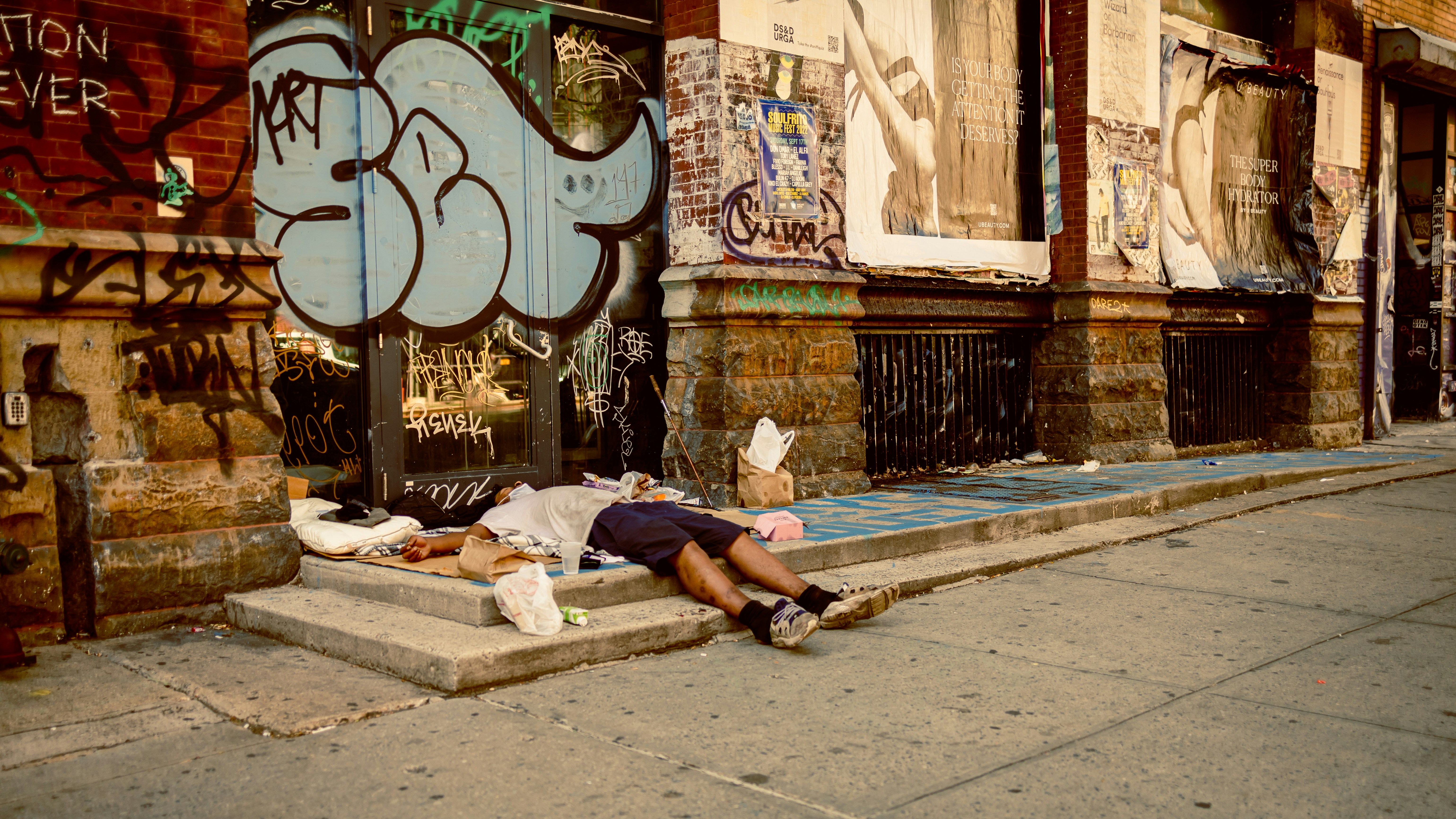 a person lying on a curb