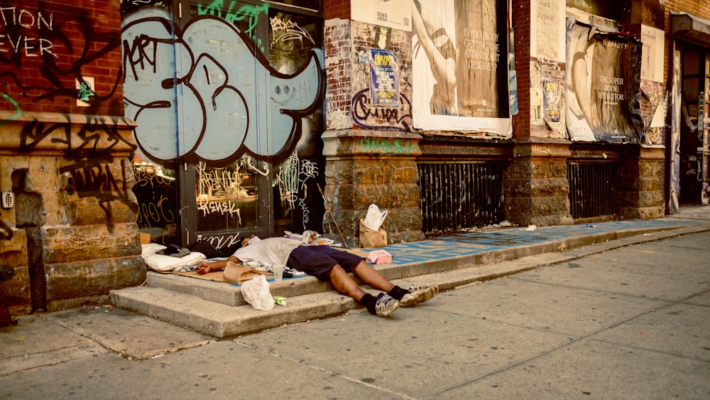 a person lying on a curb