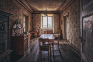 a dining room with a table and chairs