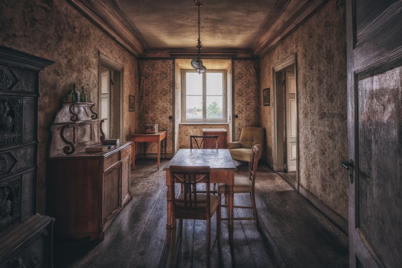 a dining room with a table and chairs
